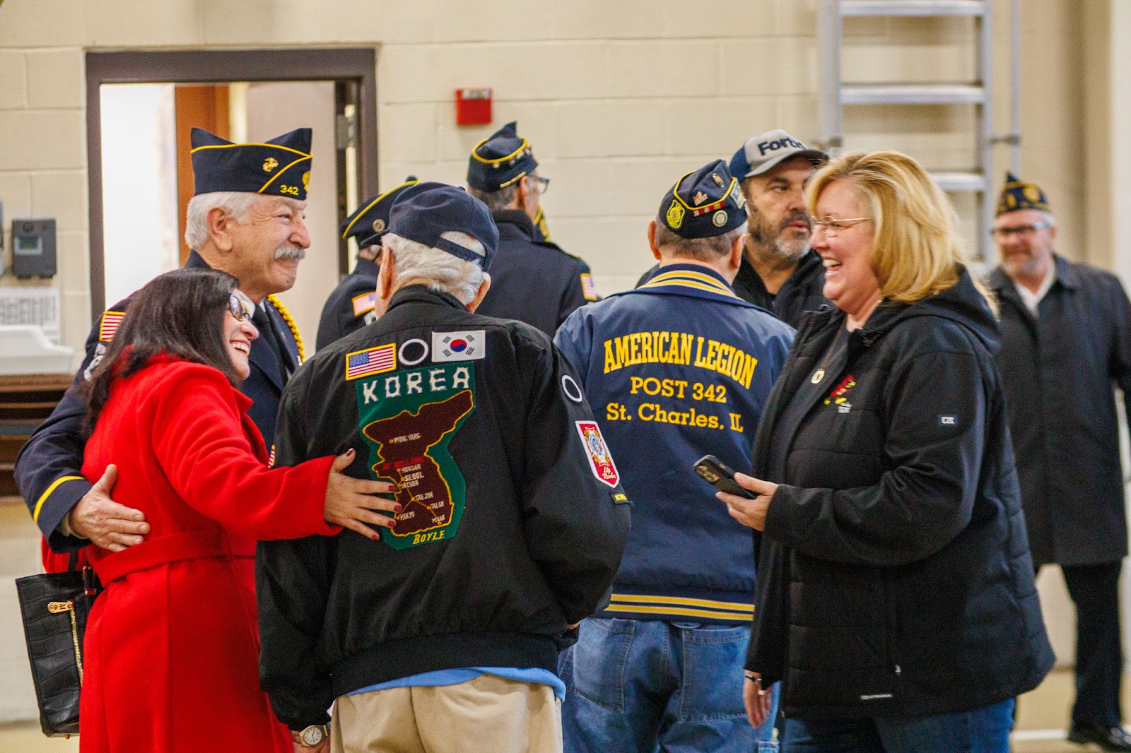 Veterans greet one another at a St. Charles community gathering